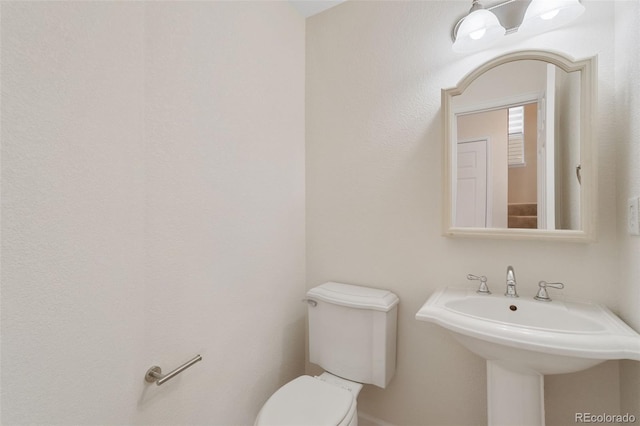 bathroom featuring toilet