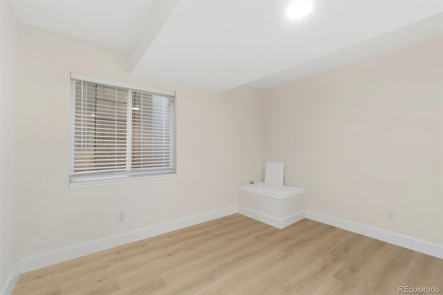 spare room featuring light wood-type flooring