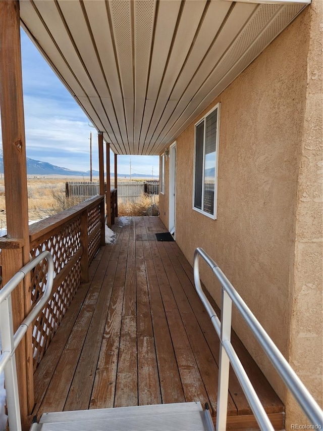 wooden deck featuring a mountain view