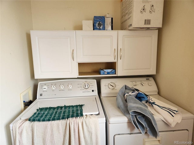 laundry area featuring cabinets and washer and dryer