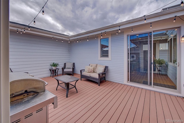 wooden terrace featuring outdoor lounge area