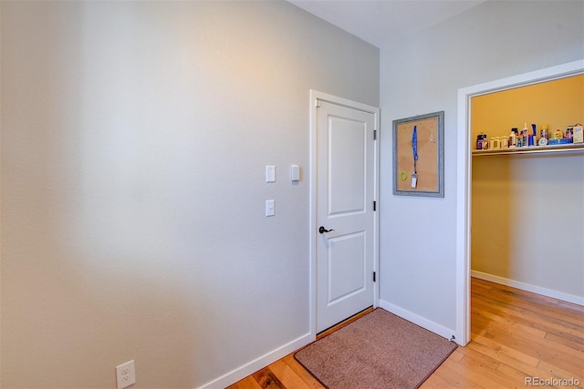 interior space with light wood-style flooring and baseboards