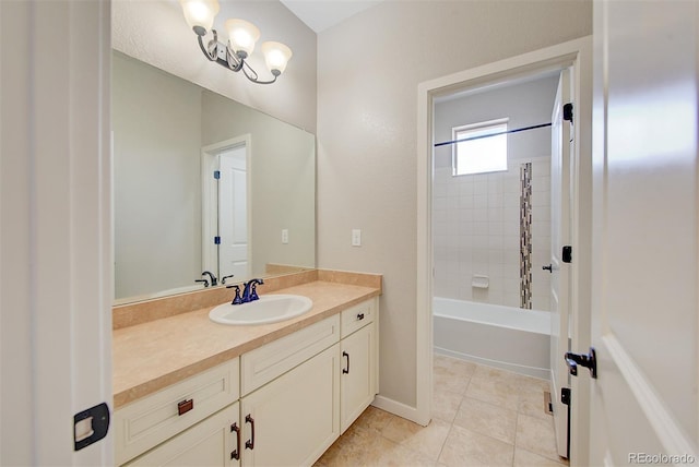 bathroom with baseboards, bathing tub / shower combination, vanity, and tile patterned floors