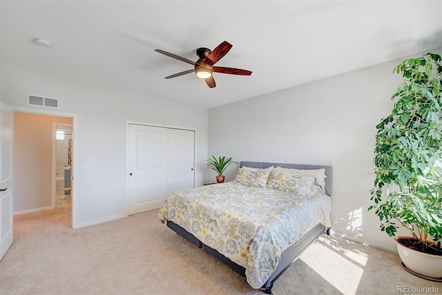 bedroom featuring light carpet, baseboards, visible vents, and ceiling fan