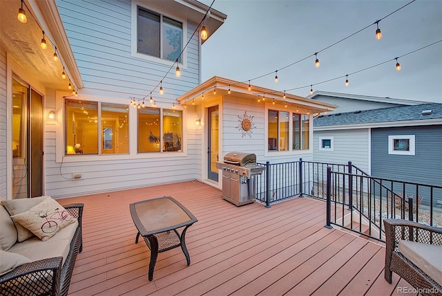 wooden deck featuring grilling area