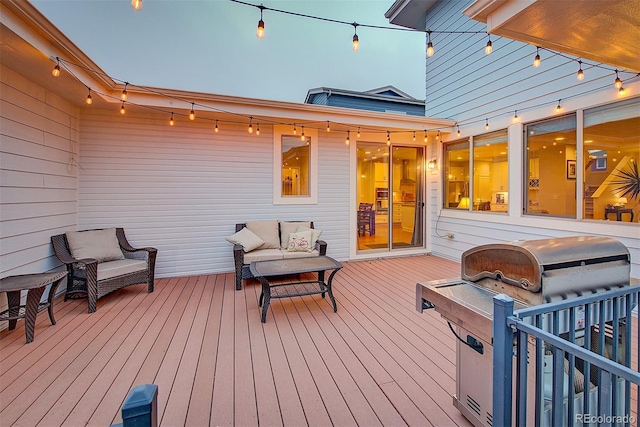 deck with an outdoor living space and area for grilling