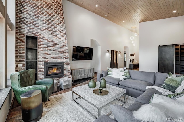 133 Adams Way, Breckenridge, CO 80424 - living room featuring high vaulted ceiling, wooden ceiling, wood finished floors, a fireplace, and recessed lighting