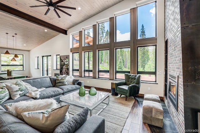 133 Adams Way, Breckenridge, CO 80424 - living area featuring wood finished floors, a fireplace, high vaulted ceiling, ceiling fan, and wood ceiling with exposed beams