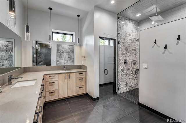 133 Adams Way, Breckenridge, CO 80424 - bathroom featuring a shower stall, double vanity, baseboards, tile patterned flooring, and a towering ceiling