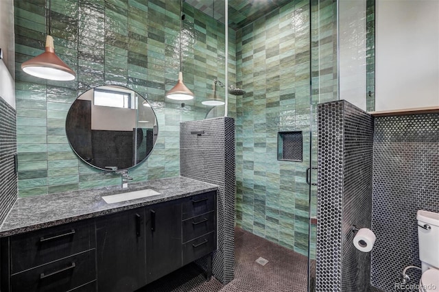 133 Adams Way, Breckenridge, CO 80424 - full bathroom featuring tile walls, vanity, a shower stall, and toilet