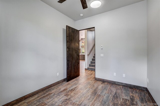 133 Adams Way, Breckenridge, CO 80424 - empty room featuring ceiling fan, wood finished floors, stairway, baseboards, and a smoke detector