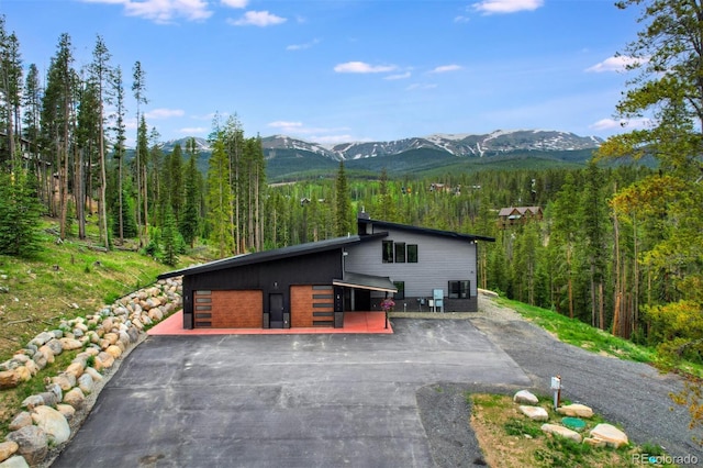 133 Adams Way, Breckenridge, CO 80424 - view of front of property featuring a mountain view, a wooded view, and a detached garage