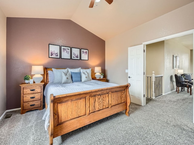 bedroom with baseboards, lofted ceiling, light carpet, and a ceiling fan