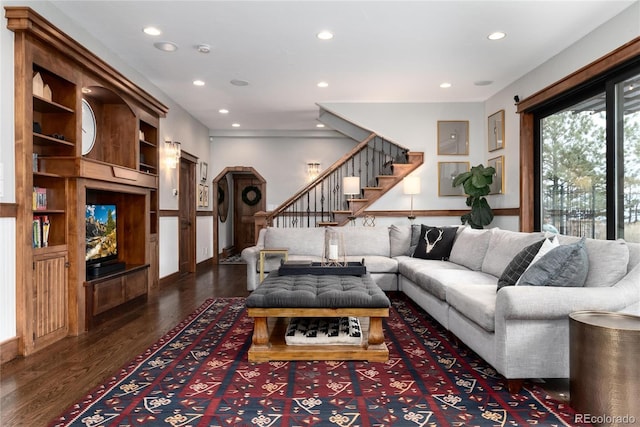 living room with recessed lighting, dark wood finished floors, and stairway