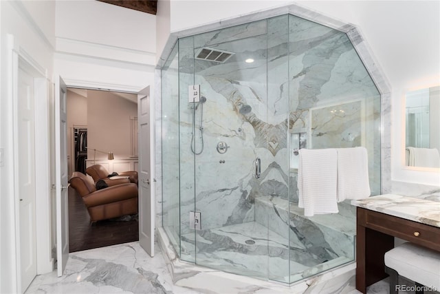 bathroom with marble finish floor, visible vents, vanity, and a marble finish shower