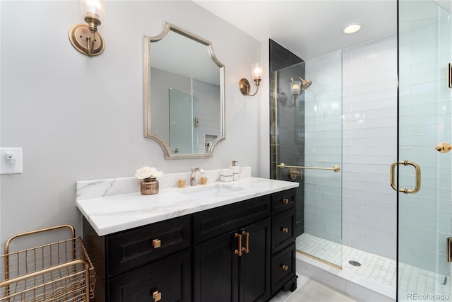 full bathroom featuring a shower stall, vanity, and recessed lighting