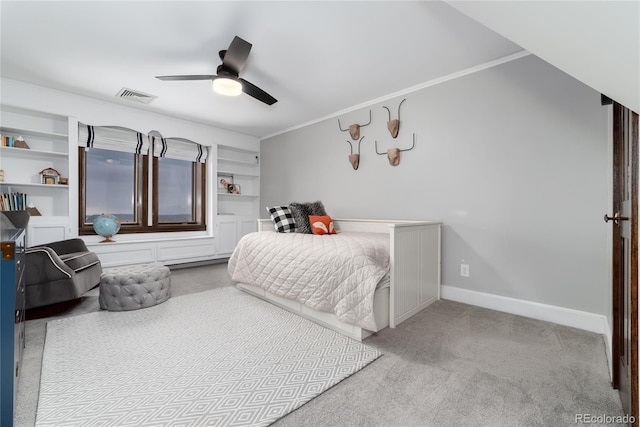 carpeted bedroom with ceiling fan, ornamental molding, visible vents, and baseboards