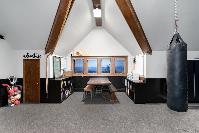 rec room featuring carpet flooring and vaulted ceiling with beams