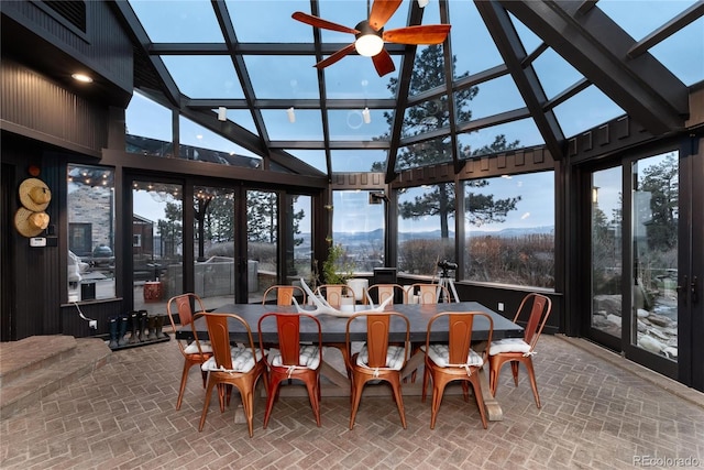 sunroom / solarium featuring ceiling fan