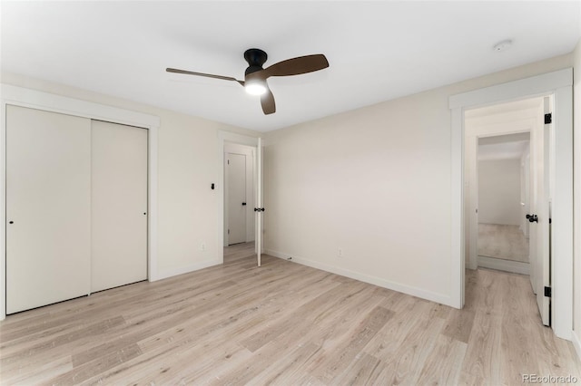 6448 Ingalls Ct, Arvada, CO 80003 - unfurnished bedroom with a closet, a ceiling fan, light wood-style flooring, and baseboards