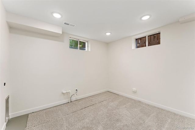 6448 Ingalls Ct, Arvada, CO 80003 - below grade area with carpet flooring, visible vents, baseboards, and recessed lighting