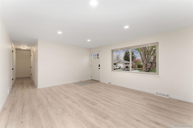 6448 Ingalls Ct, Arvada, CO 80003 - unfurnished room featuring light wood-style floors, visible vents, baseboards, and recessed lighting