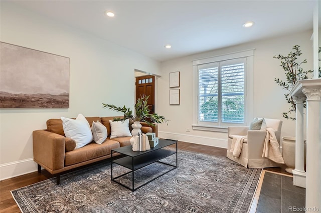living room with baseboards, recessed lighting, and dark wood-type flooring