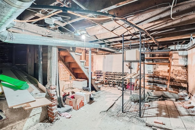 unfinished below grade area featuring stairway