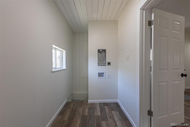 laundry area with laundry area, baseboards, dark wood finished floors, hookup for a washing machine, and electric dryer hookup