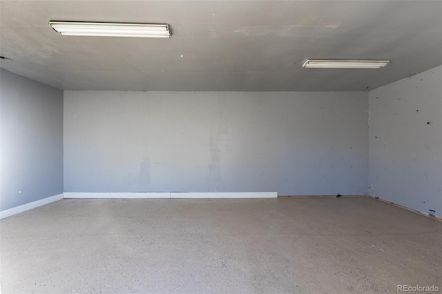 spare room featuring speckled floor