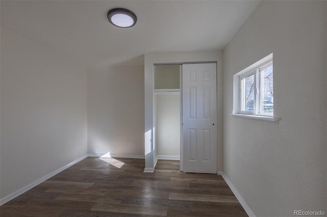 1435 Jay St, Lakewood, CO 80214 - unfurnished bedroom featuring a closet, wood finished floors, and baseboards