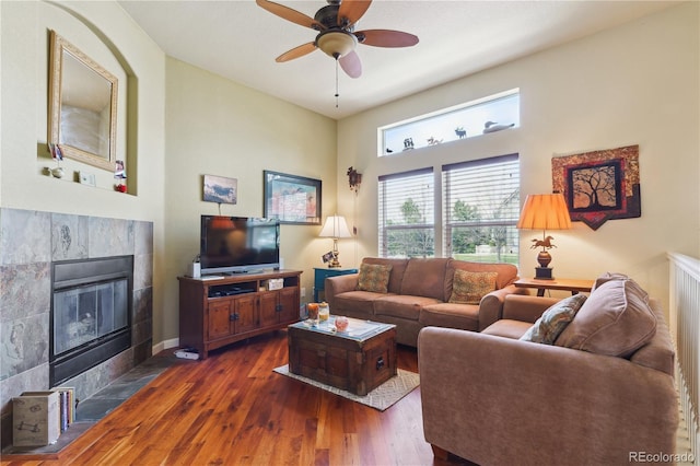 4061 Nordland Trl, Castle Rock, CO 80109 - living area with dark wood finished floors, a fireplace, baseboards, and ceiling fan