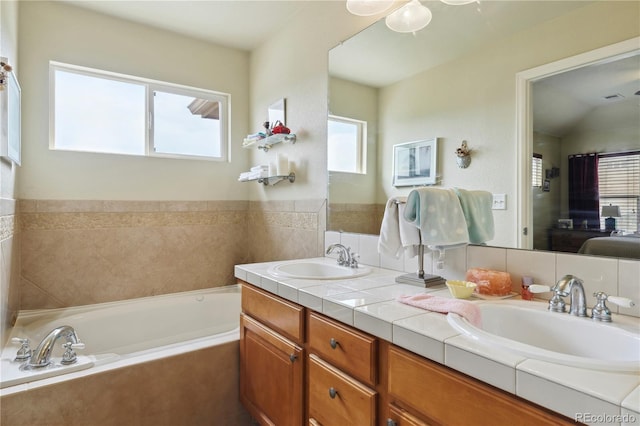 4061 Nordland Trl, Castle Rock, CO 80109 - ensuite bathroom with a bath, ensuite bath, double vanity, and a sink