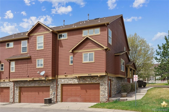 4061 Nordland Trl, Castle Rock, CO 80109 - rear view of property with stone siding and a garage