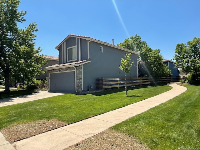 21300 E 42nd Ave, Denver, CO 80249 - view of property exterior with a tiled roof, stone siding, a garage, and driveway