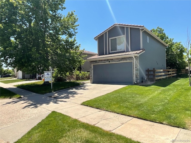 21300 E 42nd Ave, Denver, CO 80249 - view of front of house featuring a tiled roof, a garage, driveway, and stone siding