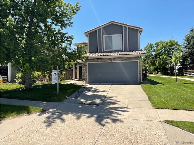 21300 E 42nd Ave, Denver, CO 80249 - view of front of home featuring a tile roof, a garage, driveway, and stone siding
