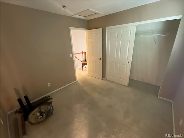21300 E 42nd Ave, Denver, CO 80249 - unfurnished bedroom featuring attic access, a closet, and carpet flooring