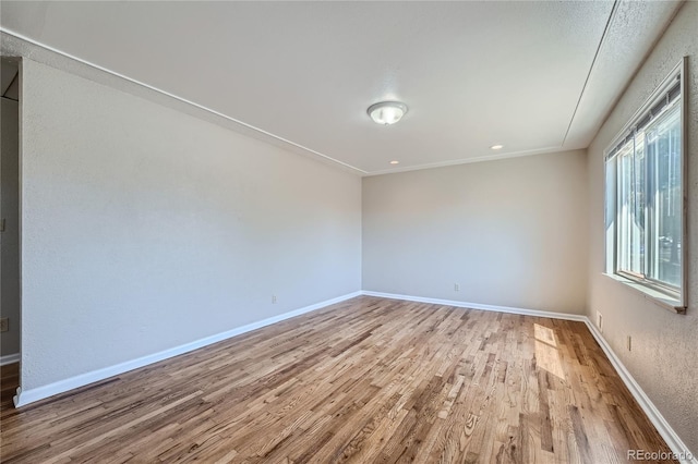 unfurnished room featuring light hardwood / wood-style flooring