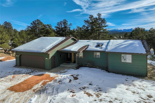 ranch-style house featuring a garage