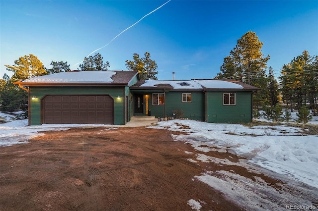 ranch-style house featuring a garage