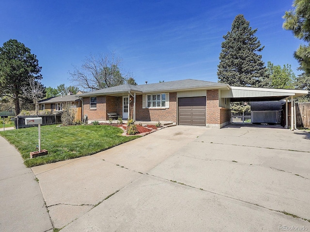 5225 Beech St, Arvada, CO 80002 - ranch-style house with a garage, driveway, brick siding, and an attached carport