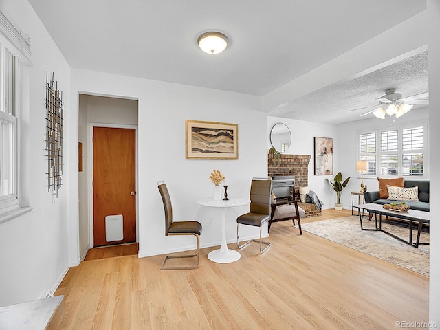 5225 Beech St, Arvada, CO 80002 - sitting room with wood finished floors, a ceiling fan, and baseboards