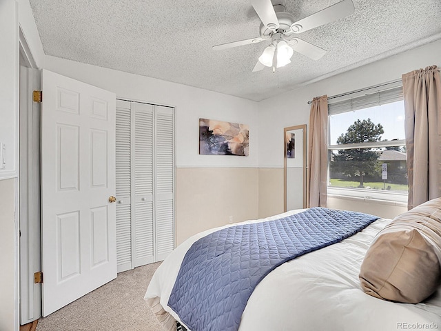 5225 Beech St, Arvada, CO 80002 - bedroom featuring a textured ceiling, light colored carpet, a closet, and ceiling fan