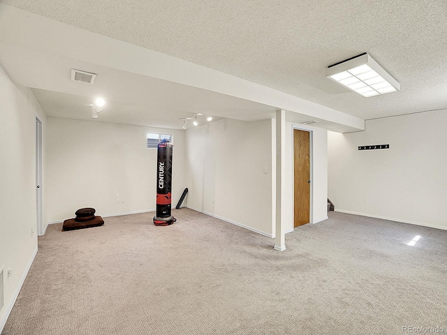 5225 Beech St, Arvada, CO 80002 - finished basement featuring carpet flooring, baseboards, a textured ceiling, and stairway