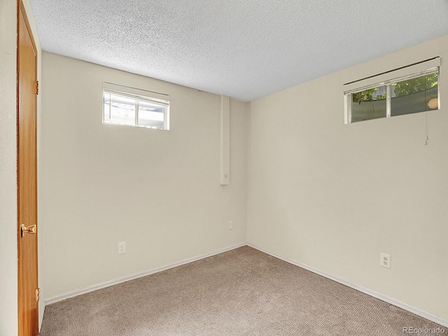 5225 Beech St, Arvada, CO 80002 - below grade area with carpet flooring, a textured ceiling, and baseboards