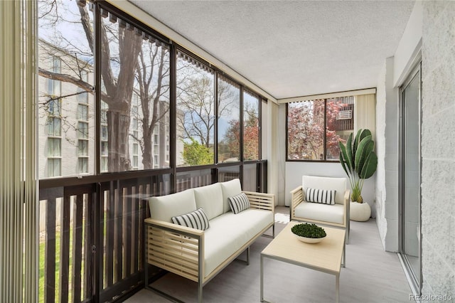 sunroom with an outdoor living space