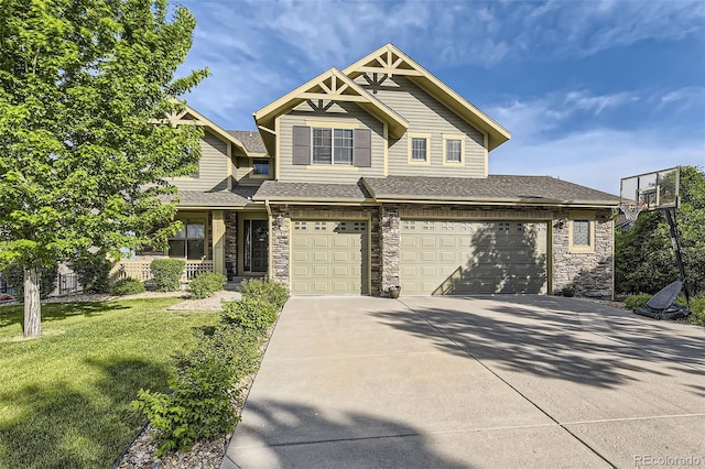 view of front of home featuring a front lawn and a garage