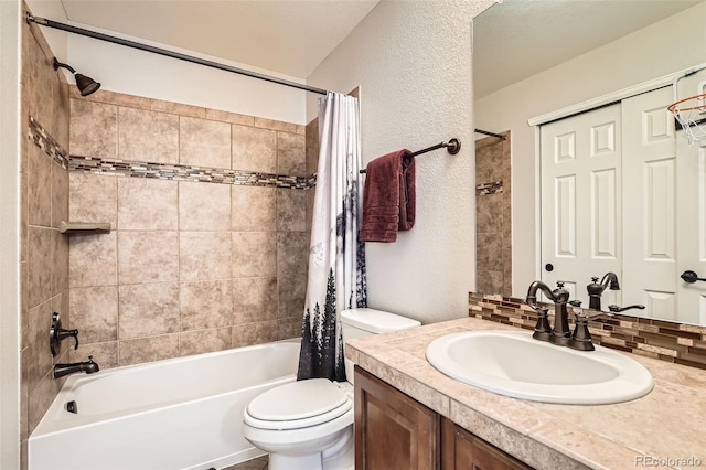 full bathroom featuring decorative backsplash, shower / tub combo, vanity, and toilet