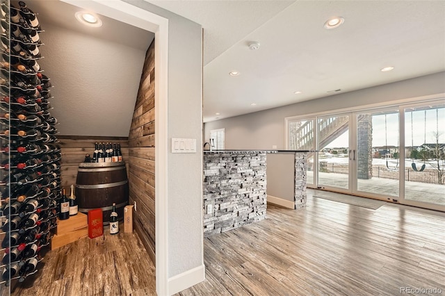 wine area with hardwood / wood-style flooring